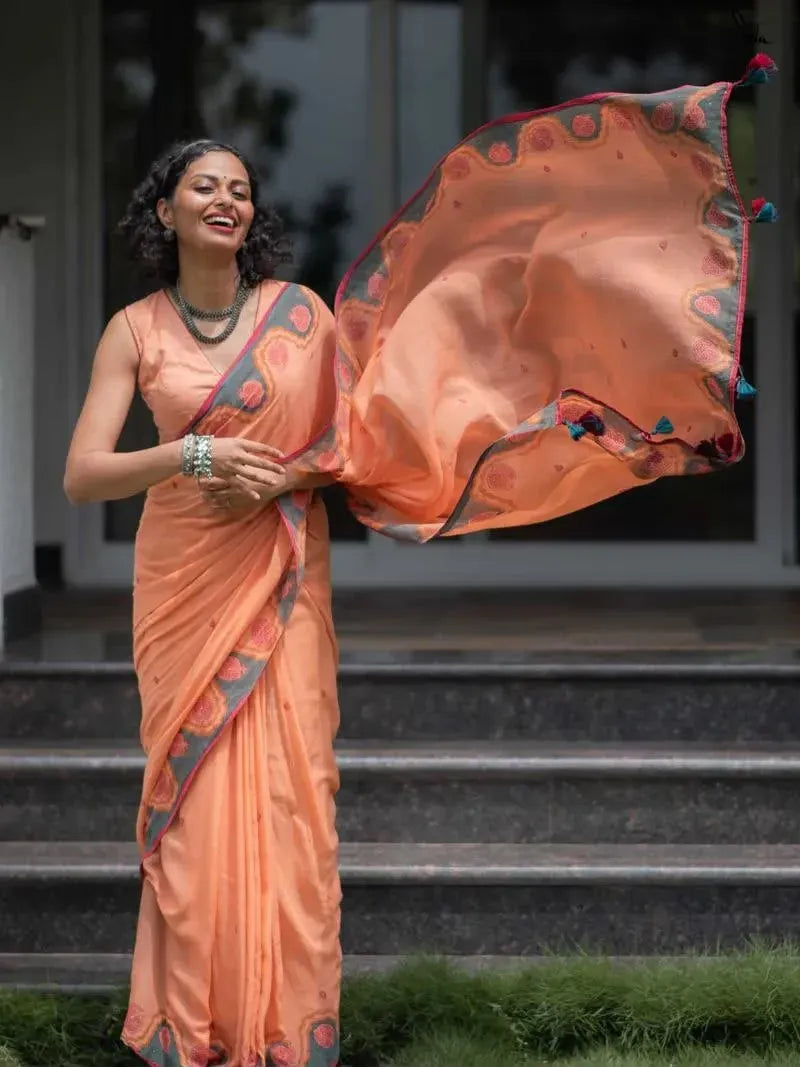 Model wearing peach linen cotton saree with digital print