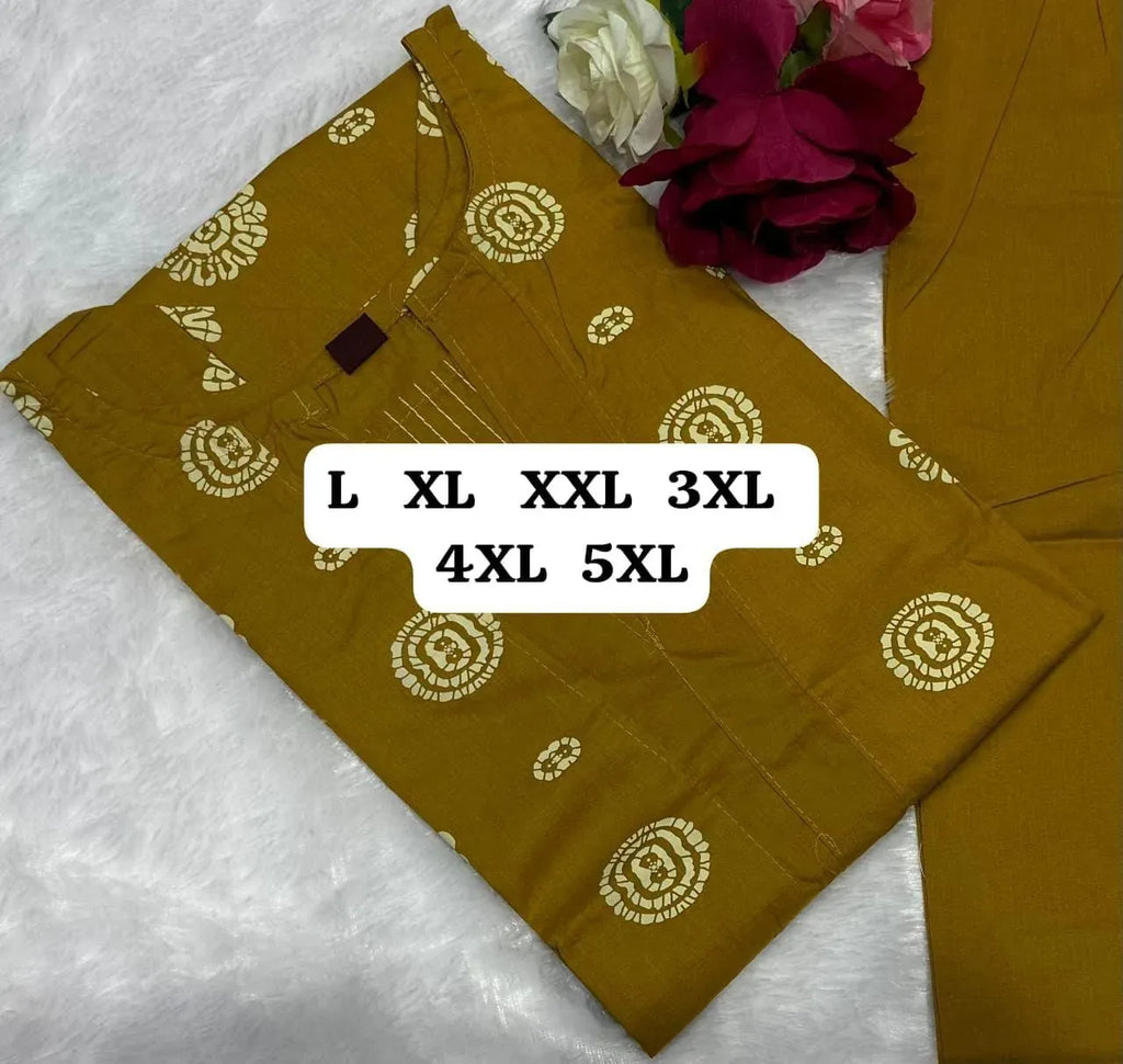 Mustard yellow dhabu cotton kurti and pant set folded with floral decor