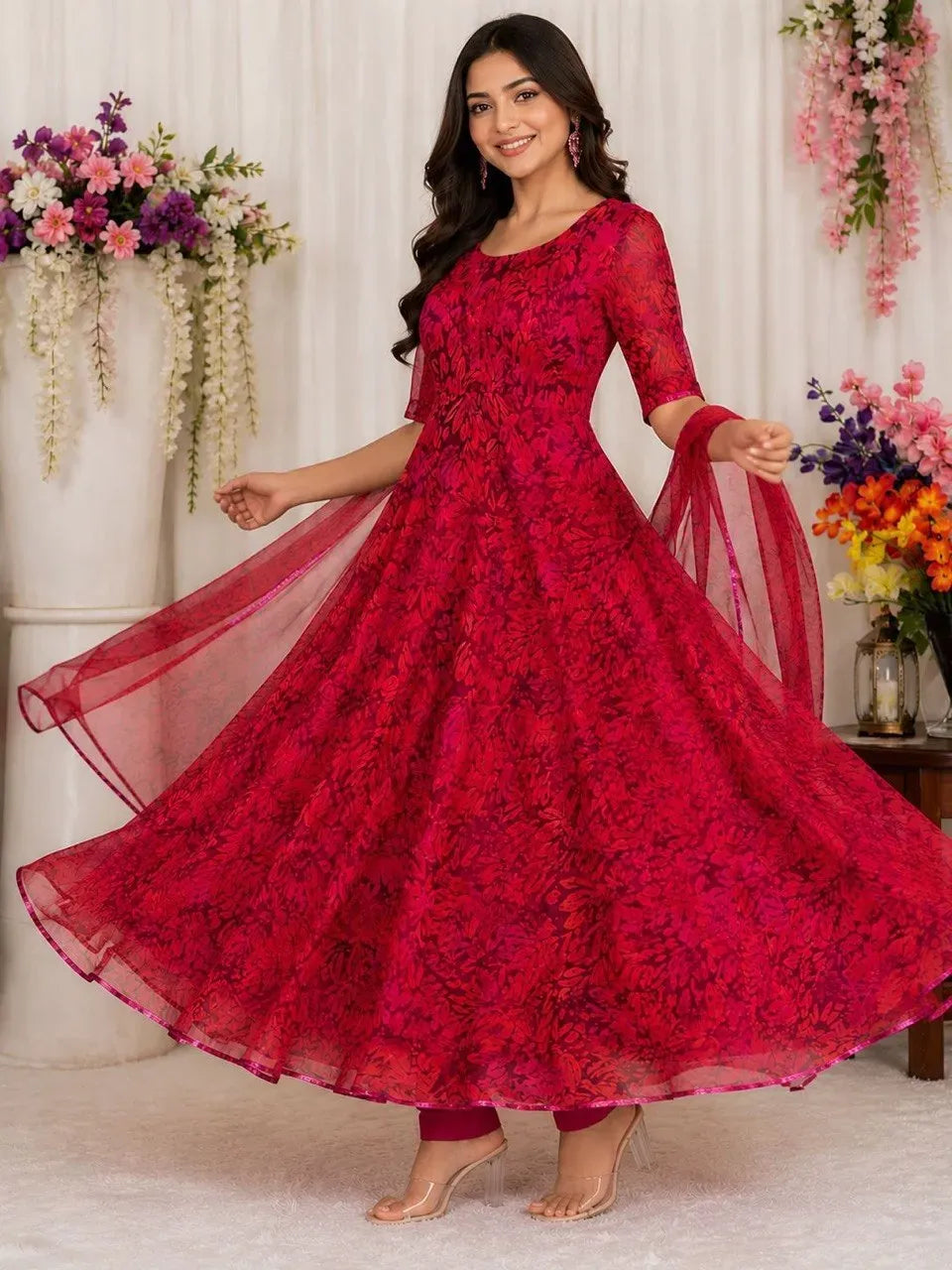 Model wearing a pink digital printed georgette silk anarkali suit with huge flair