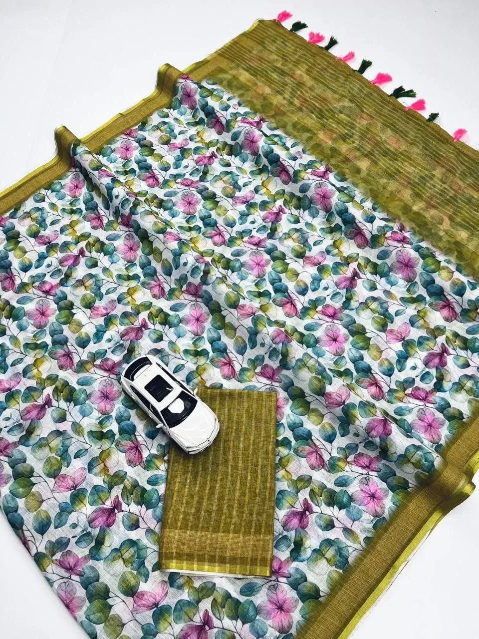 White linen saree with pink and green floral digital print and toy car