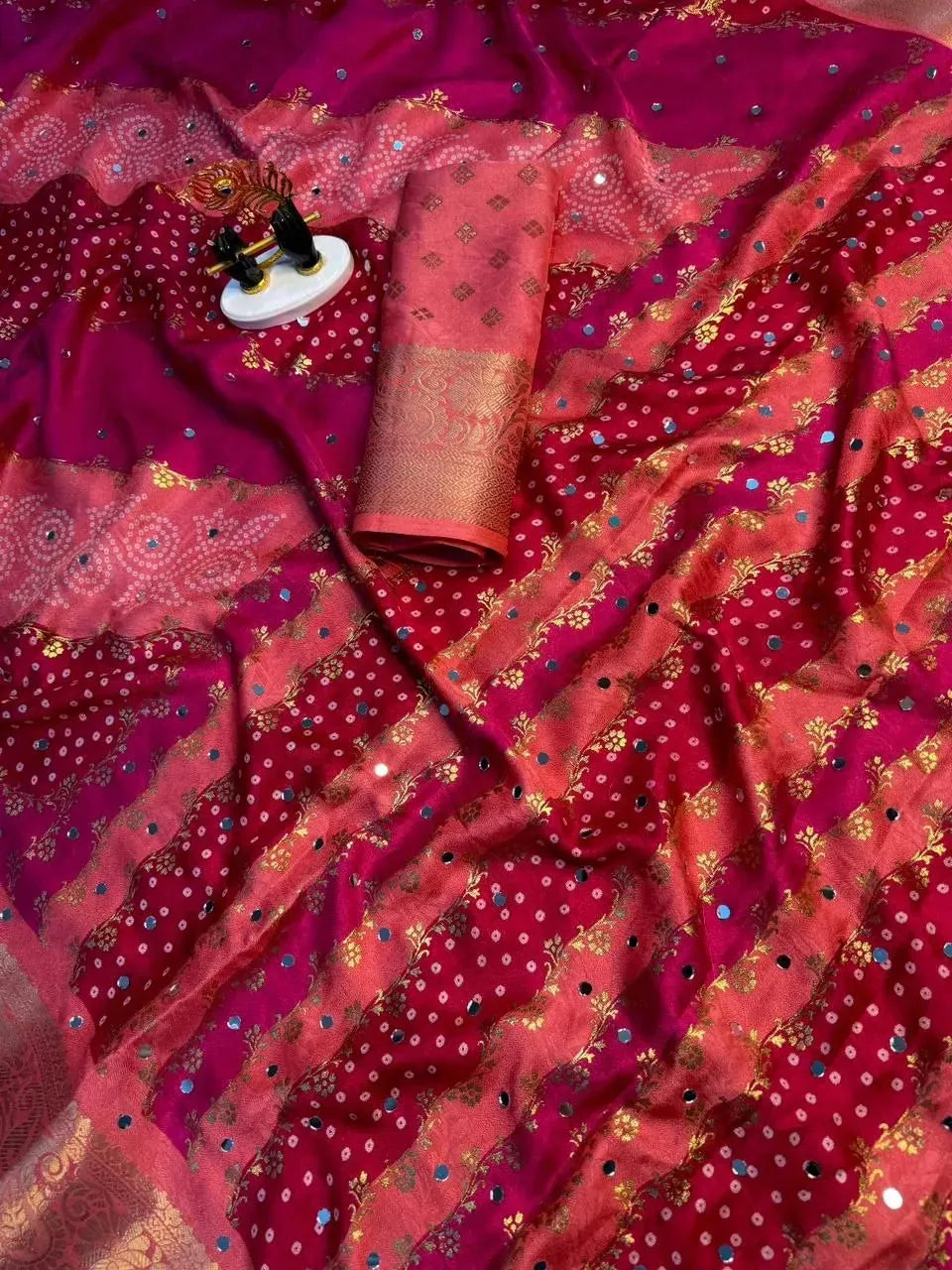 Pink georgette saree with bandhej pattern and mirror work