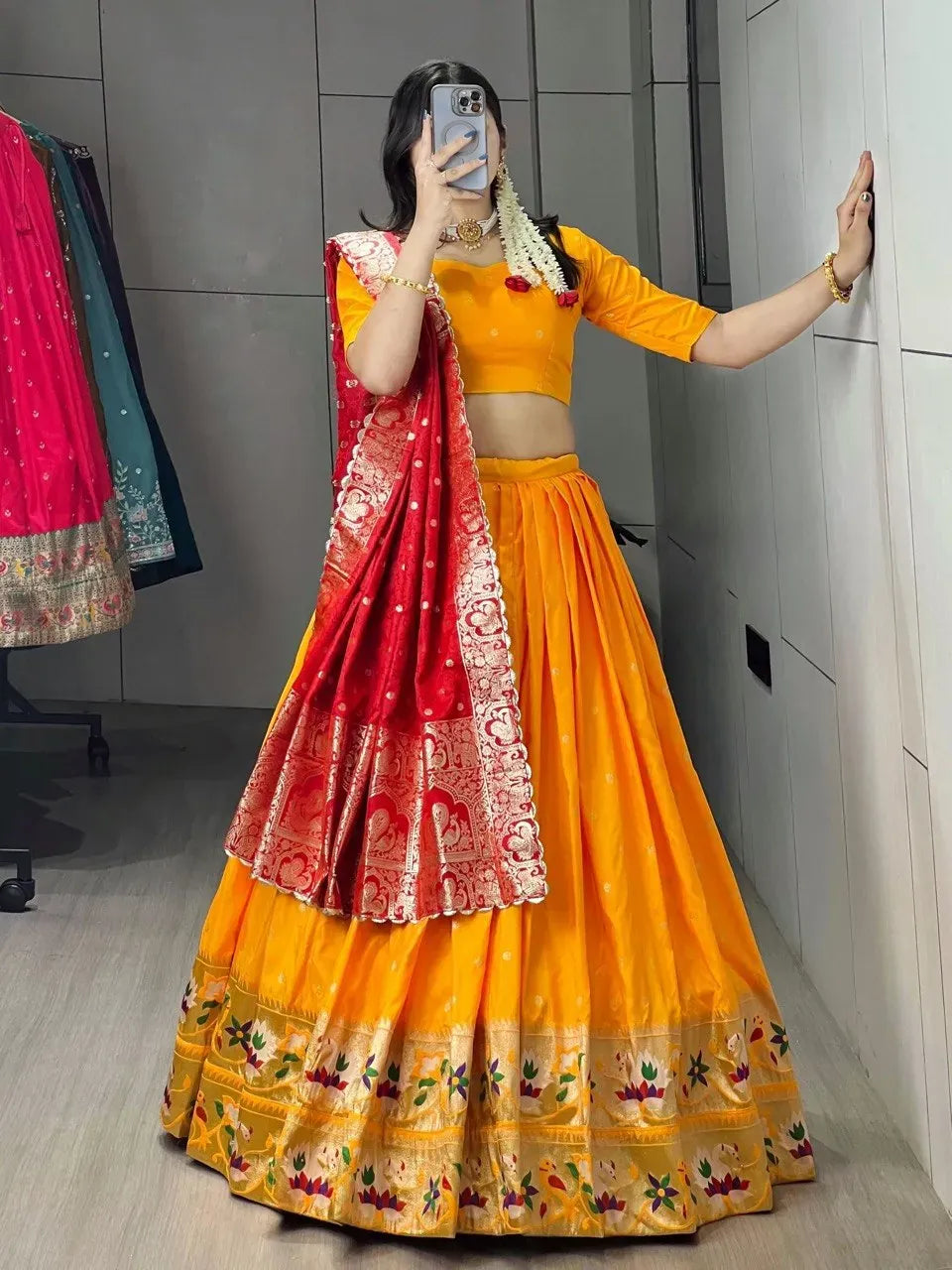 Full body front view of woman in golden Paithani lehenga and red zari woven dupatta