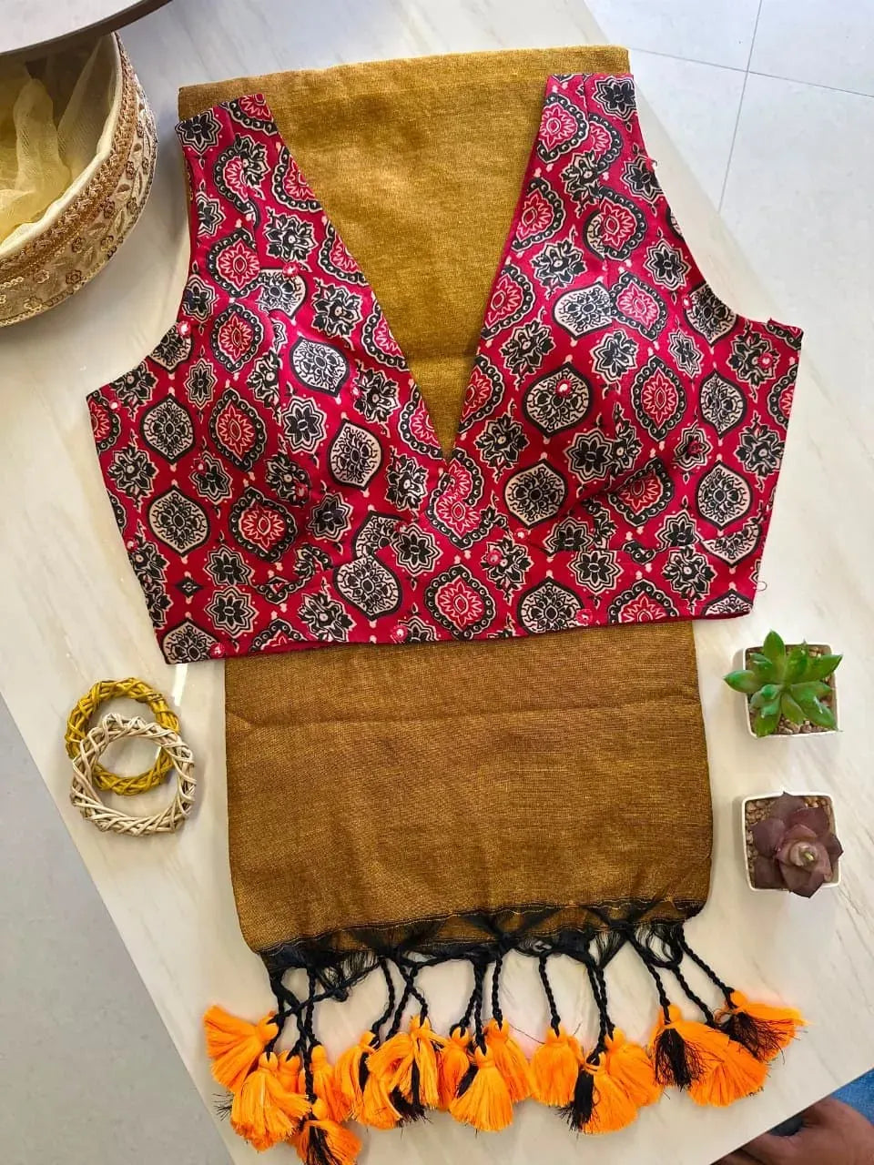 Mustard handloom cotton saree with designer red printed blouse and tassels