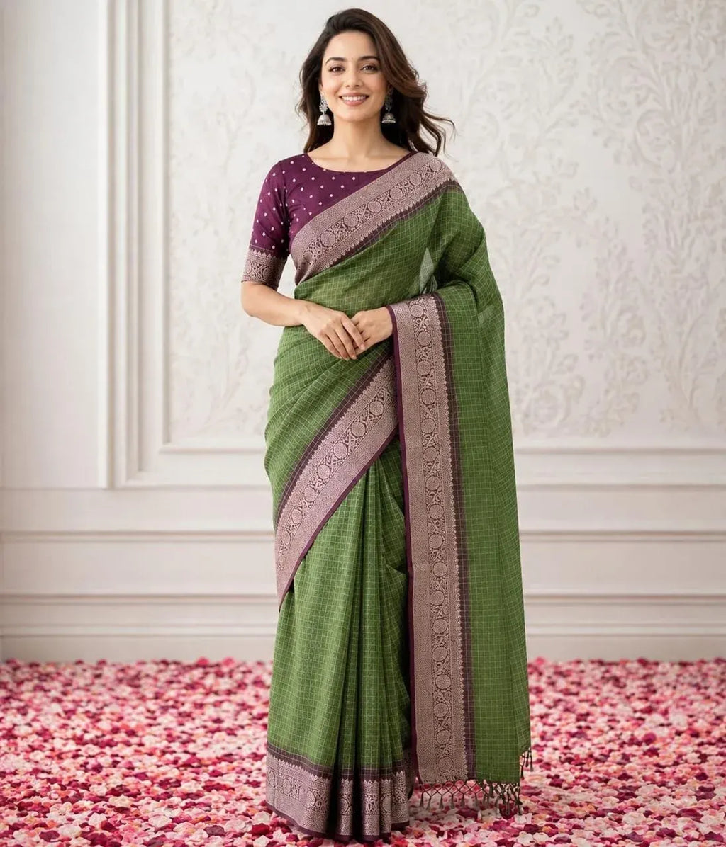 Model wearing green kora organza saree with zari work