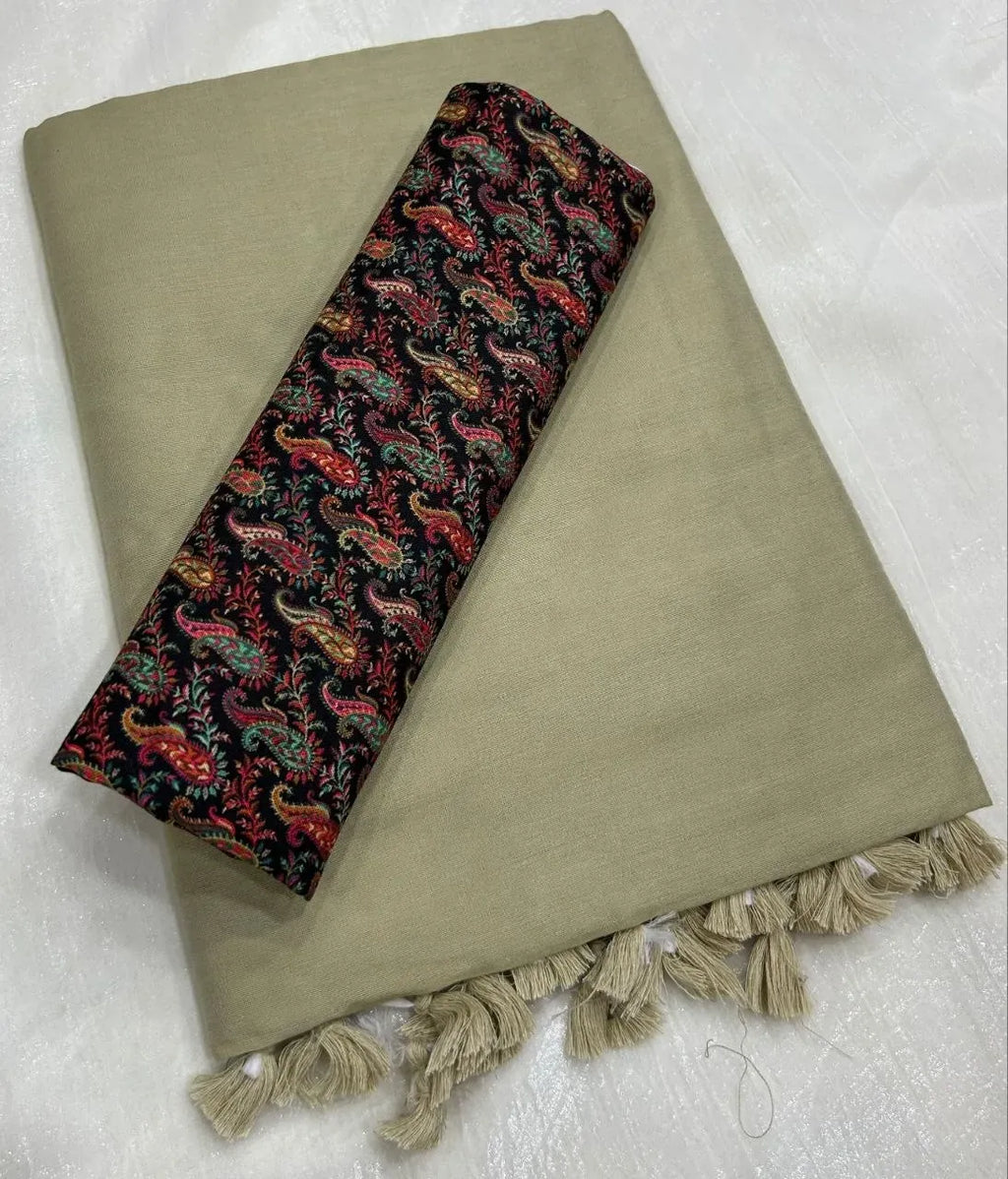 Light olive green mal cotton saree with black and colorful paisley printed blouse piece and tassels