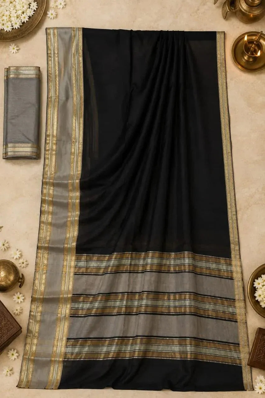 Full flat lay view of black and grey cotton saree with gold zari border and matching blouse