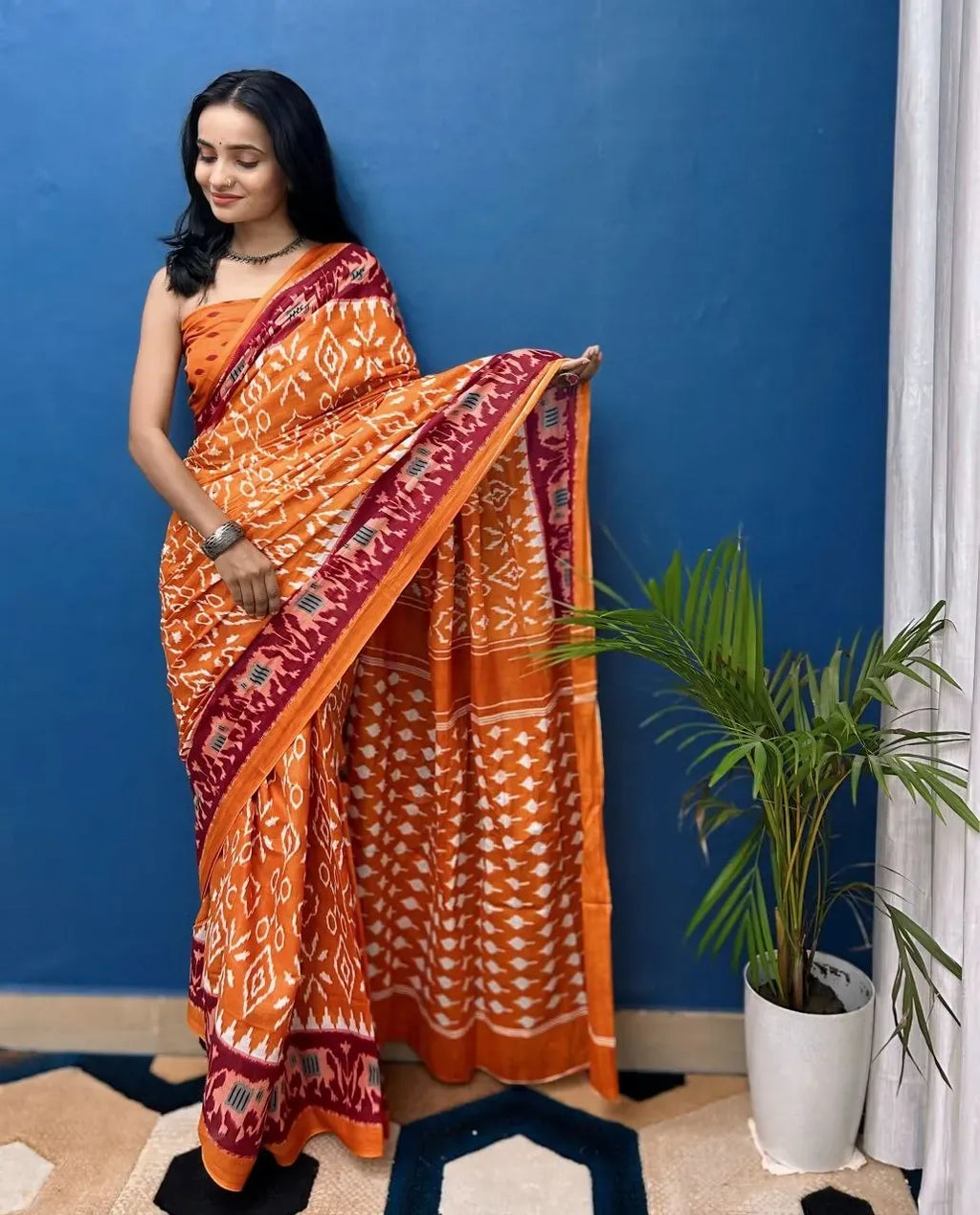 Model wearing orange pure cotton Jaipur block print saree