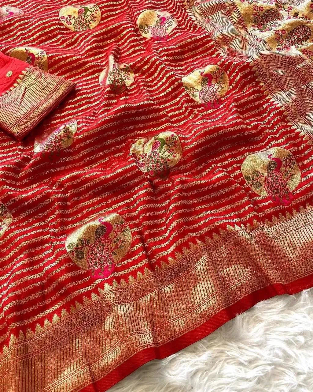 Red pure khadi crepe silk saree with gold zari border and peacock motifs
