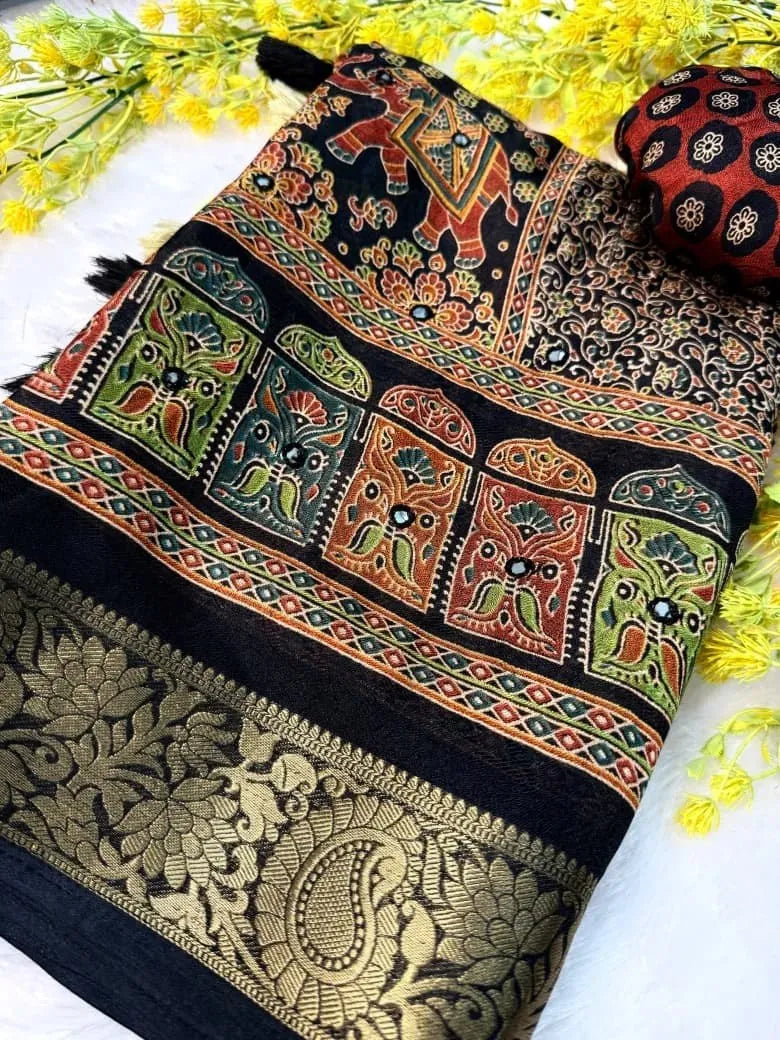 Folded black soft crepe silk saree with jacquard weaving and mirror work