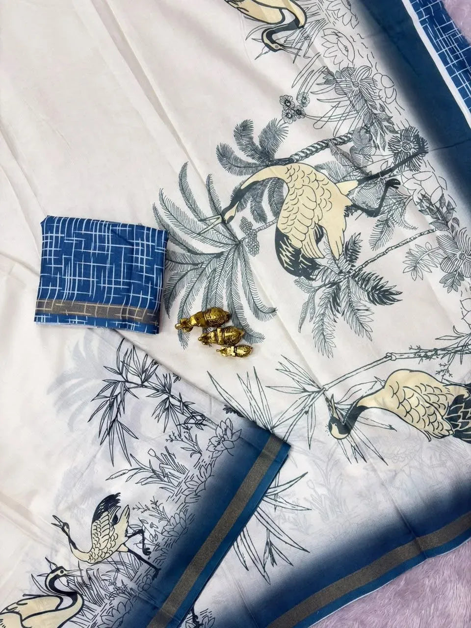 White soft mul cotton saree with blue crane print and folded blouse