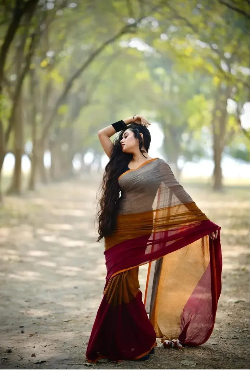 Full body shot of model posing gracefully in mul cotton saree outdoors