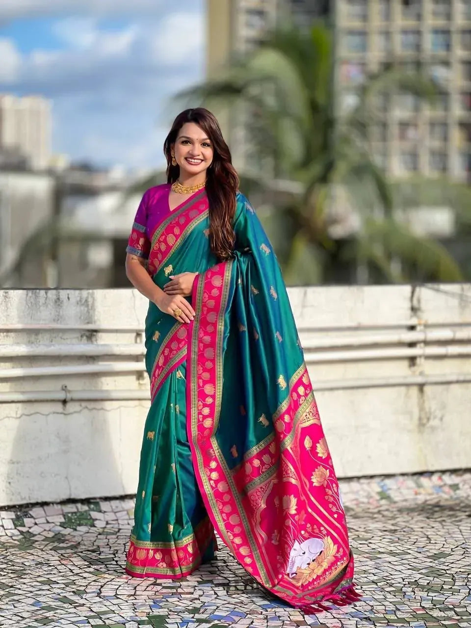 Model wearing green soft silk Paithani saree with Nandi motifs
