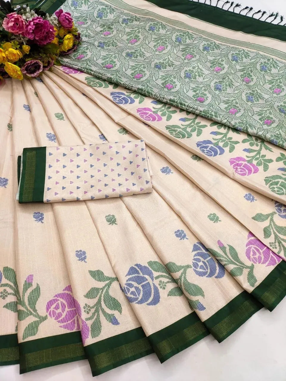 Cream soft tusser silk saree with green floral pattern and green border