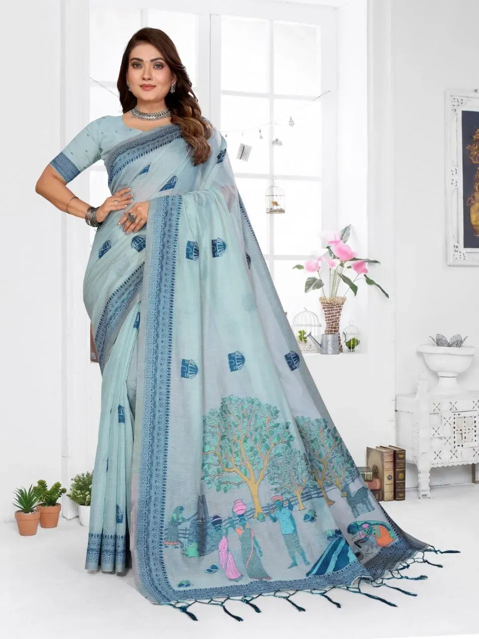 Model wearing light blue jacquard saree standing front view