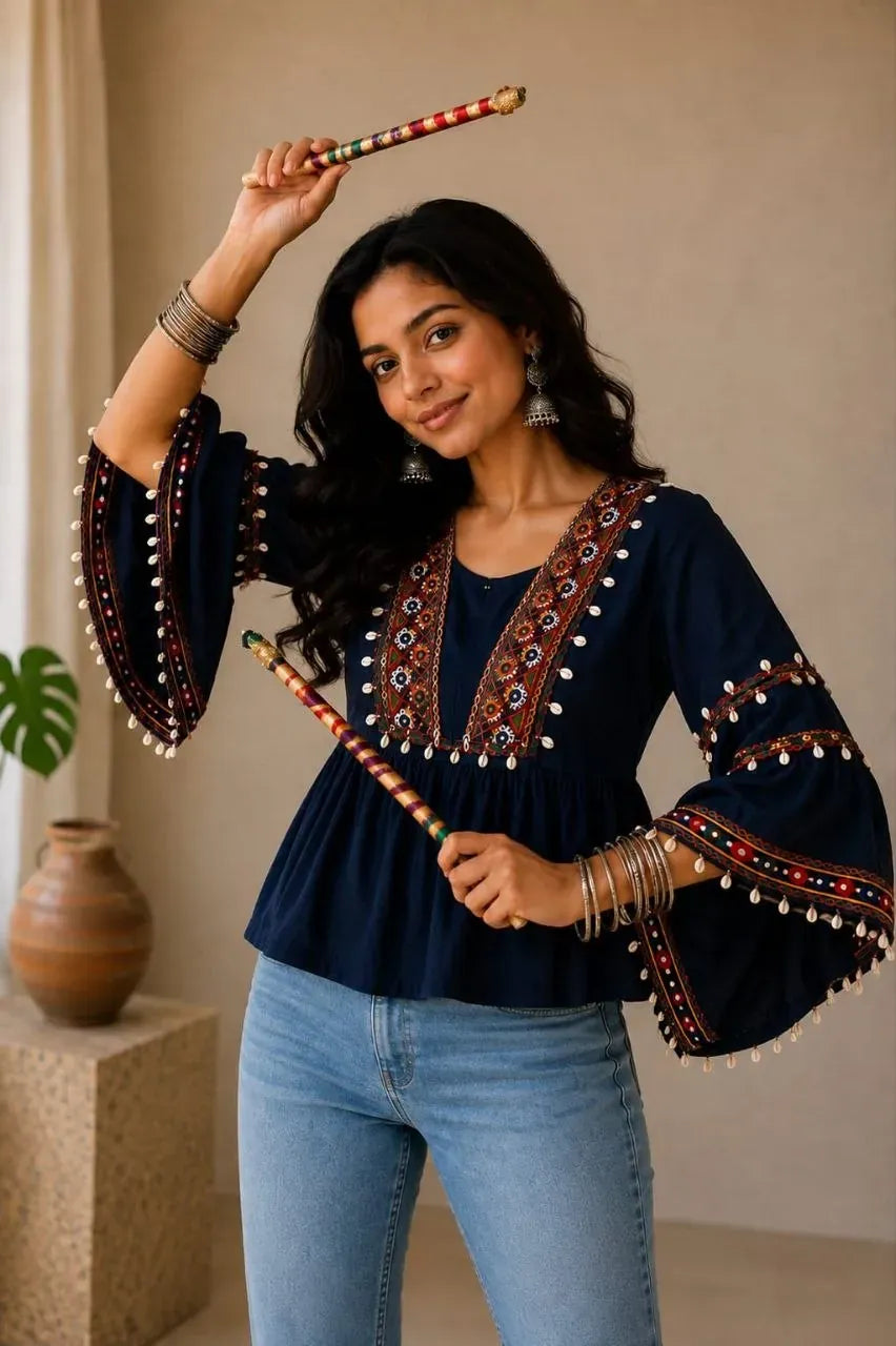 Model wearing dark blue traditional short top with mirror work and bell sleeves