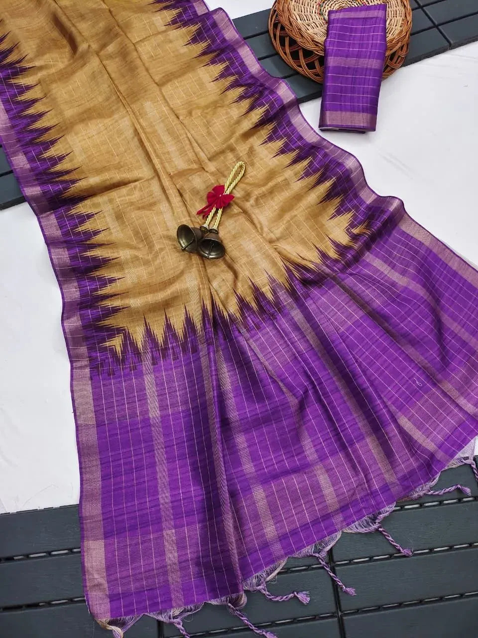 Golden and purple soft tussar silk saree flat lay with matching blouse piece