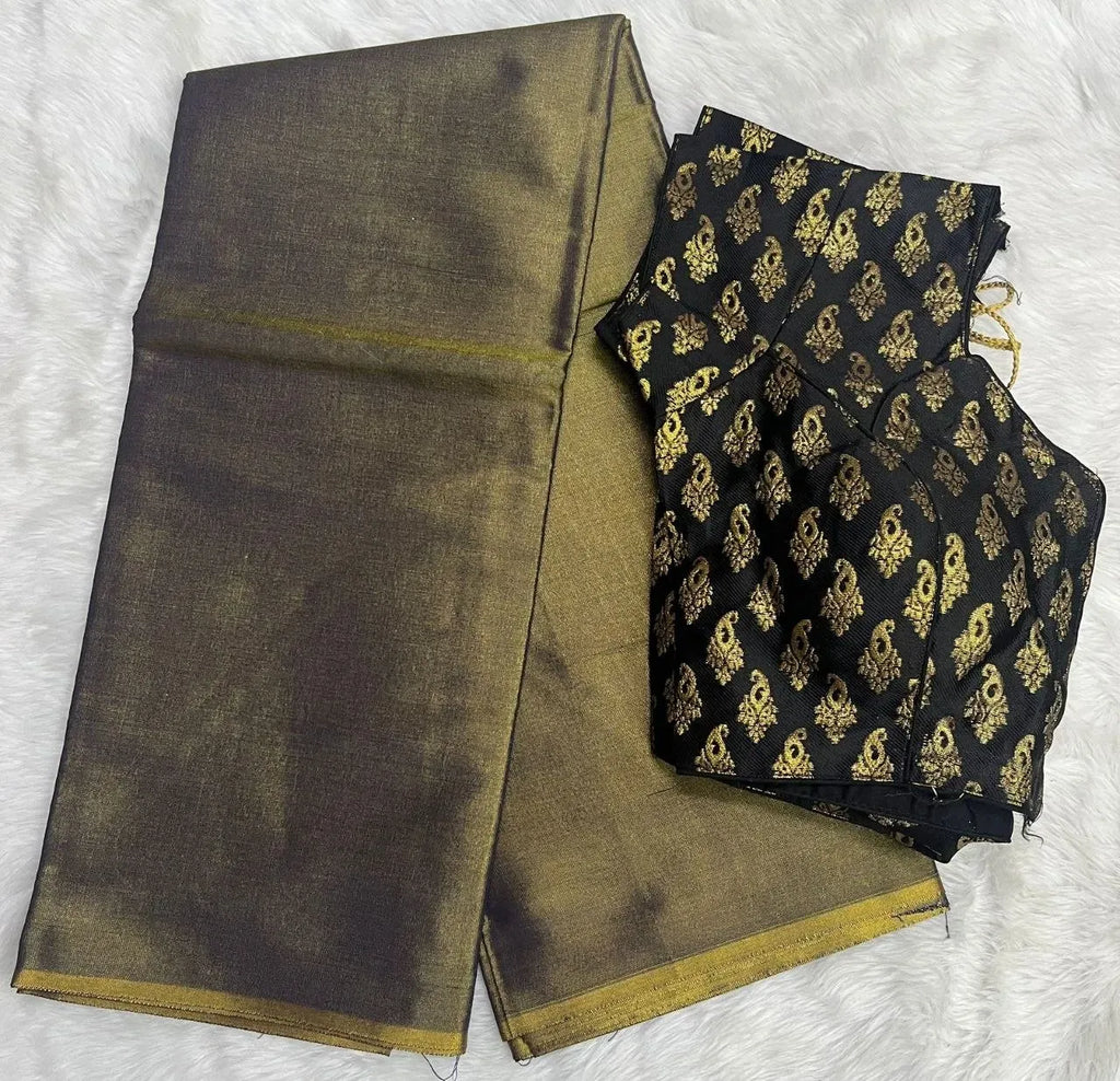 Folded dark brown uppada pattu saree with black and gold jacquard stitched blouse