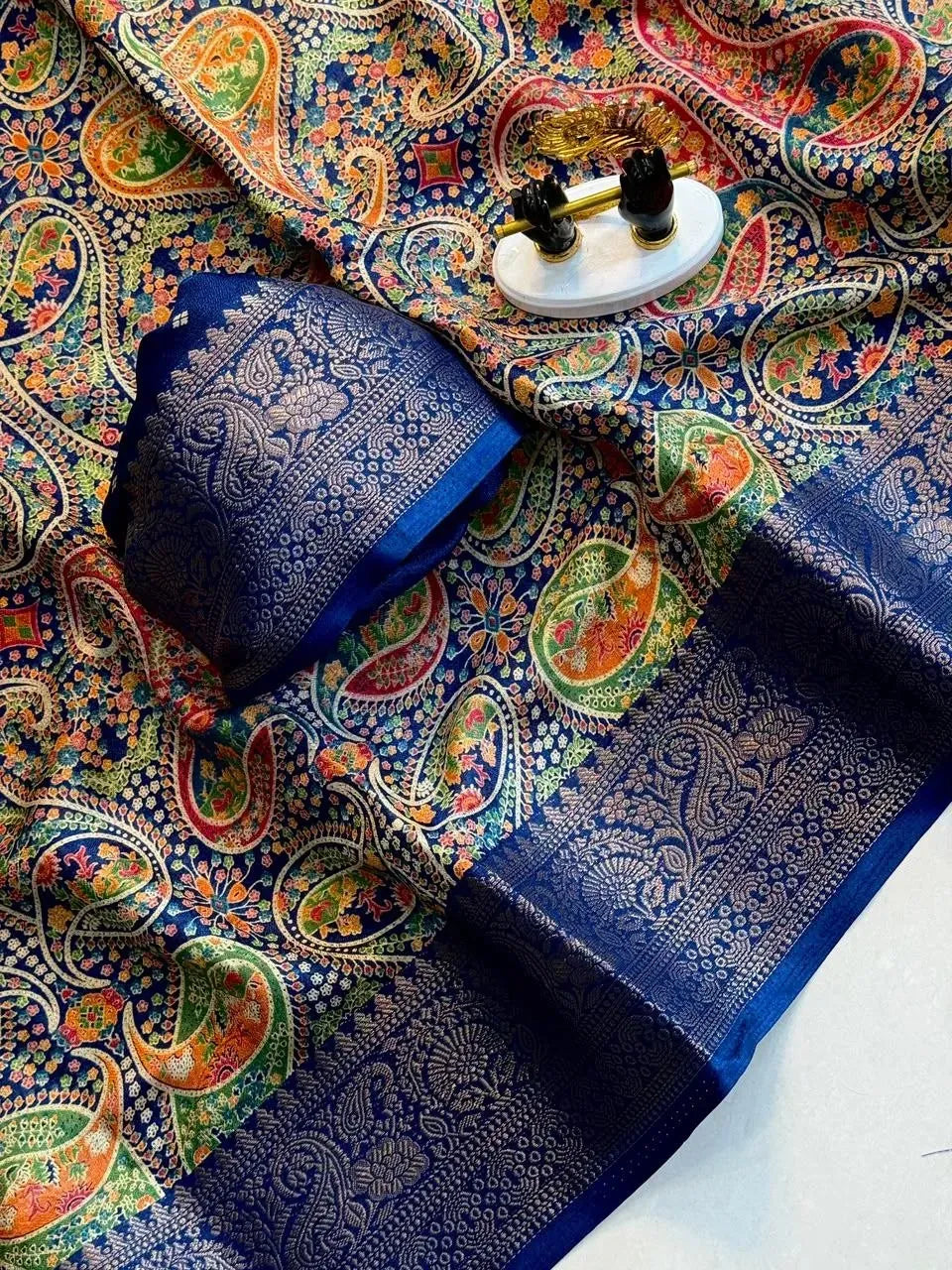 Blue georgette saree showcasing traditional ajrakh print and ornate zari border