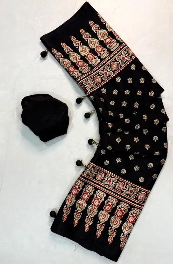 Full flat lay view of black Ajrakh silk saree with patterned pallu and attached blouse