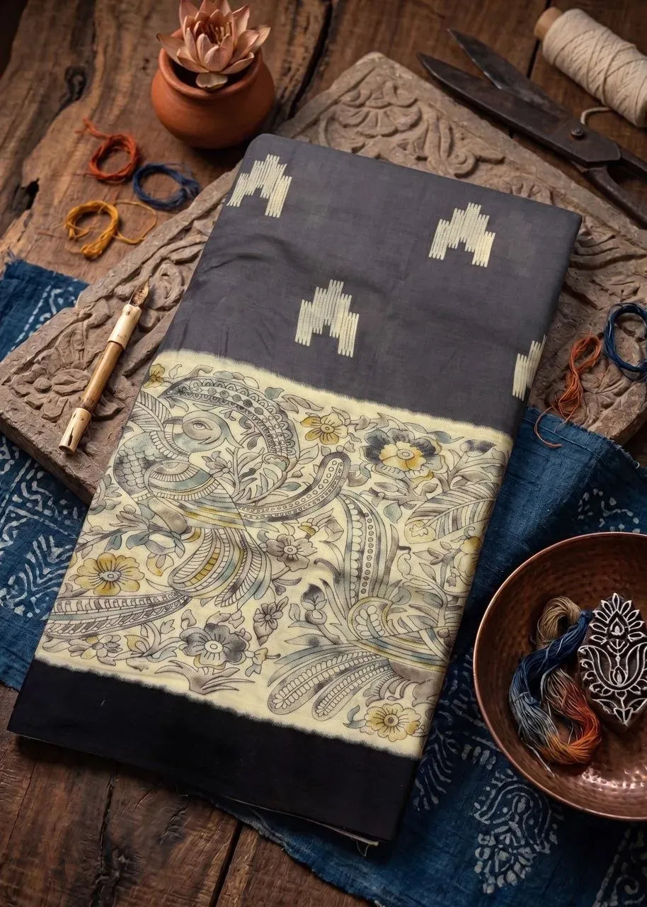 Charcoal grey soft cotton saree with Ikat motifs and Kalamkari border