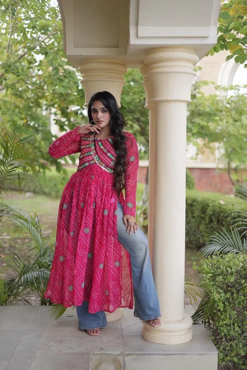 Side profile view of model posing in pink bandhani kurti with patchwork