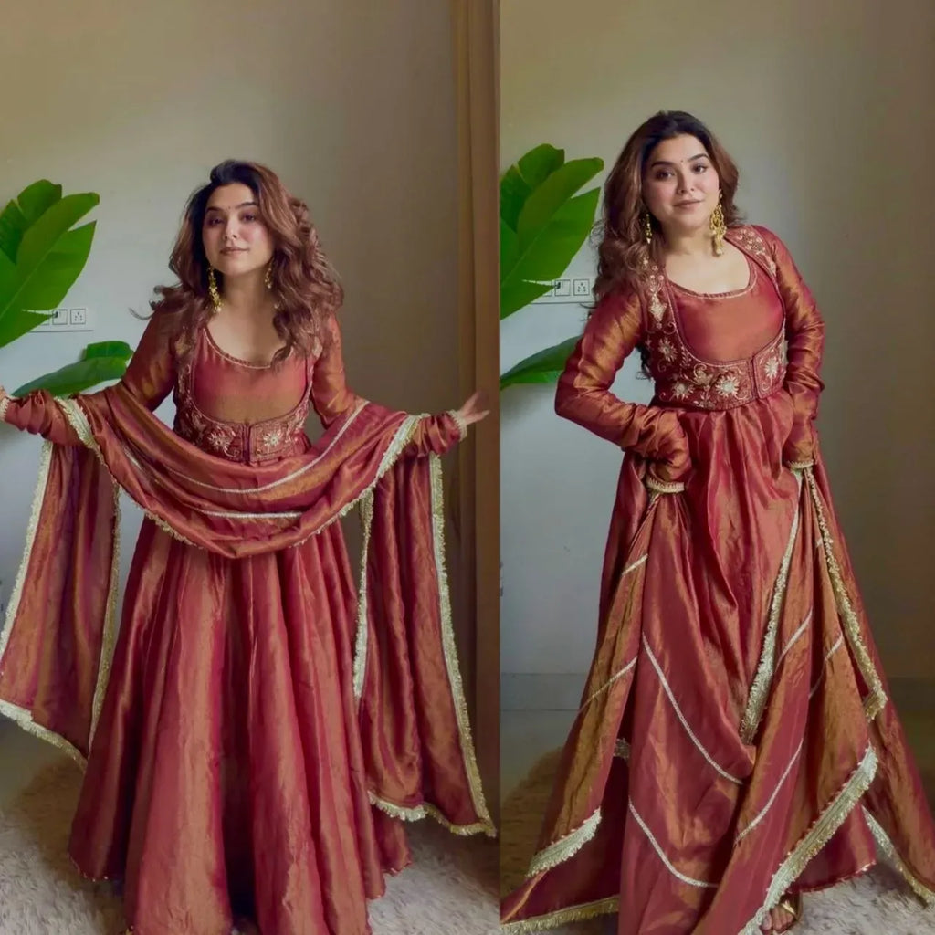 Woman wearing heavy cosmos silk maroon anarkali suit with sequence work and dupatta
