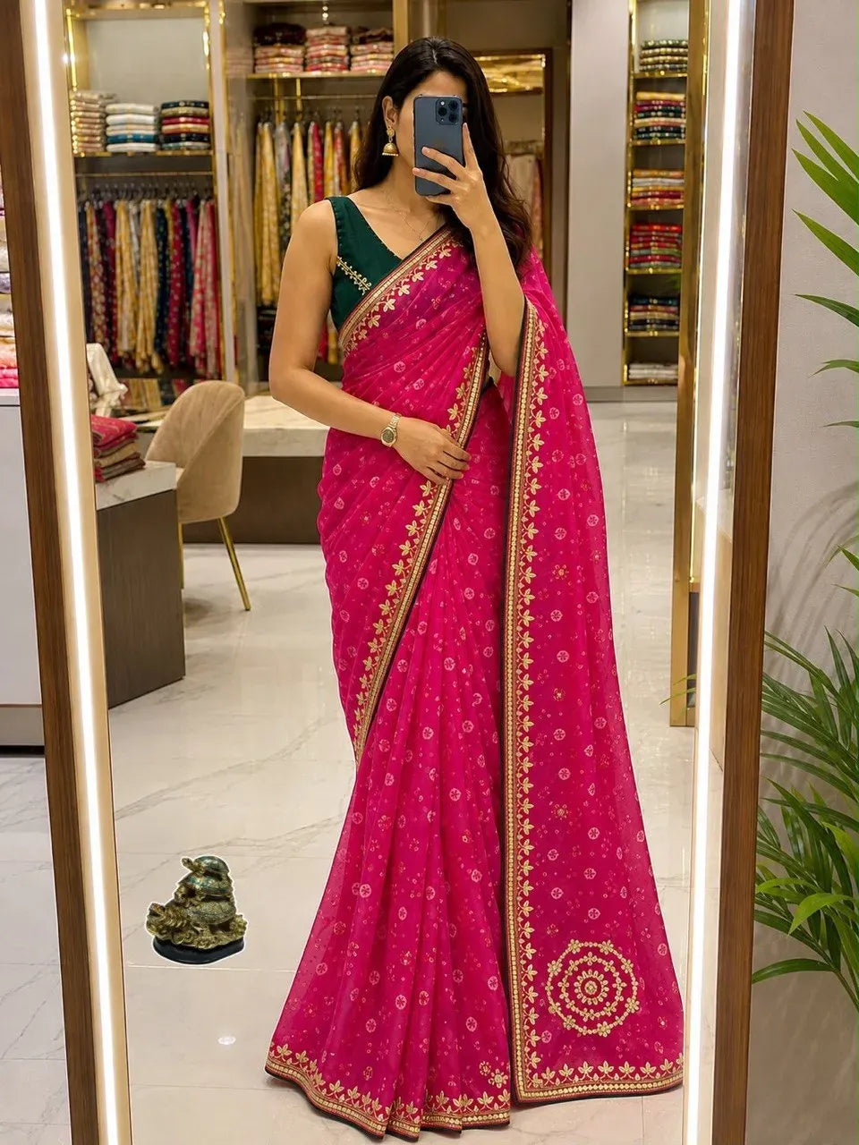 Model wearing pink georgette bandhani print saree with gotta work border