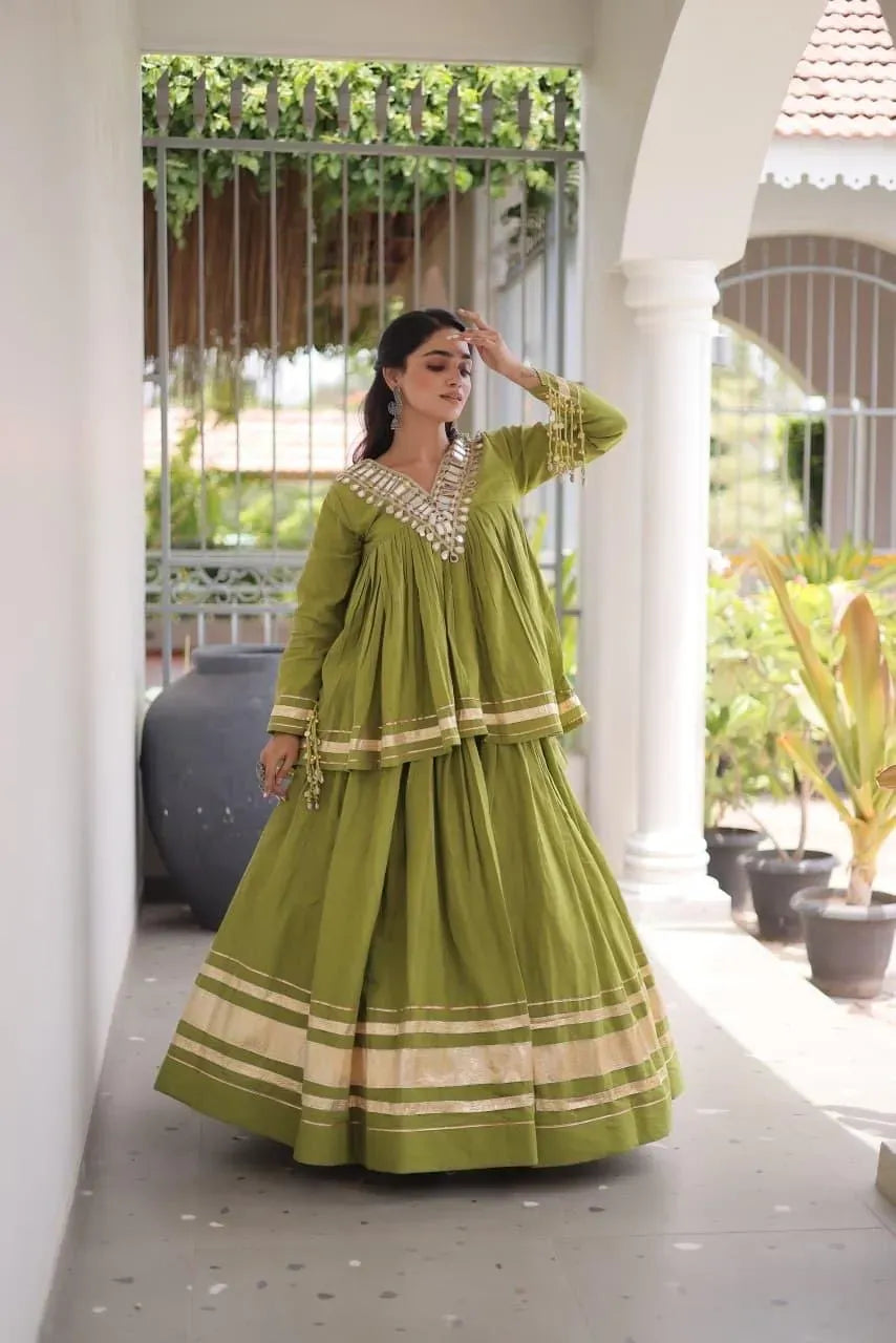 Model wearing olive green kora cotton lehenga with zari patta