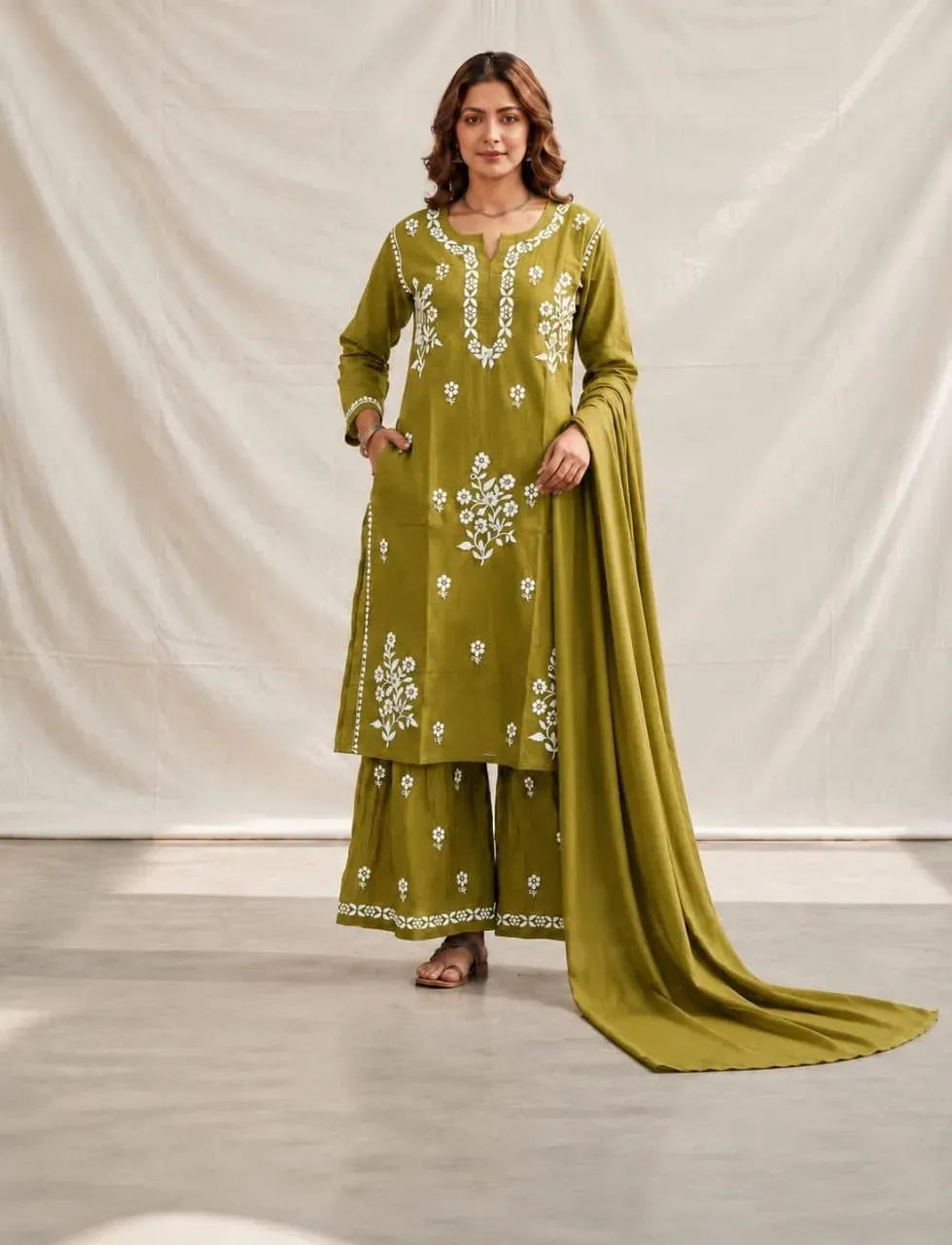 Mahendi green cotton silk kurti and sharara set with white chikankari embroidery on model