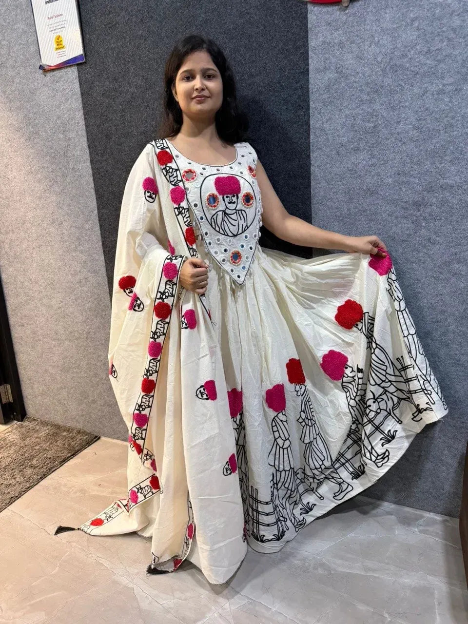 Woman wearing off white embroidered lehenga choli and dupatta