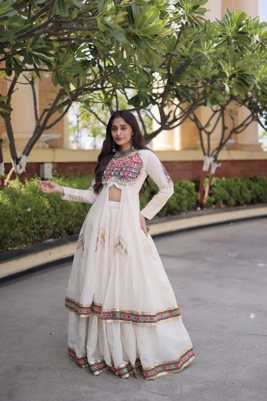Model wearing white festive kora cotton shrug lehenga outdoors