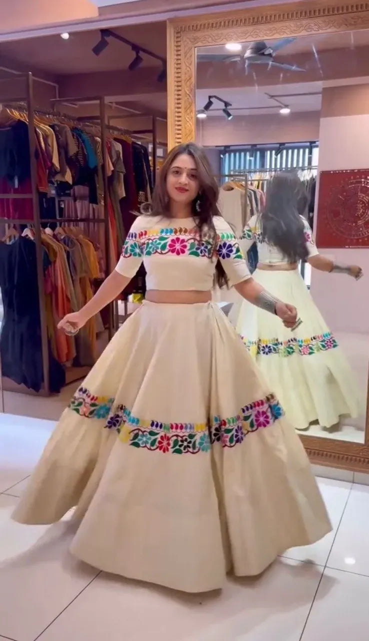 Woman wearing off-white gamthi work cotton lehenga in store