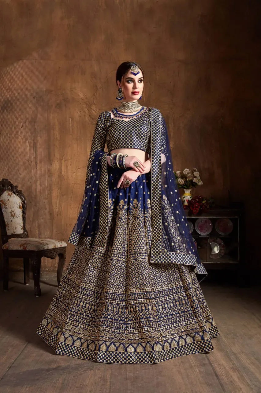 Model wearing royal navy blue embroidered lehenga front view