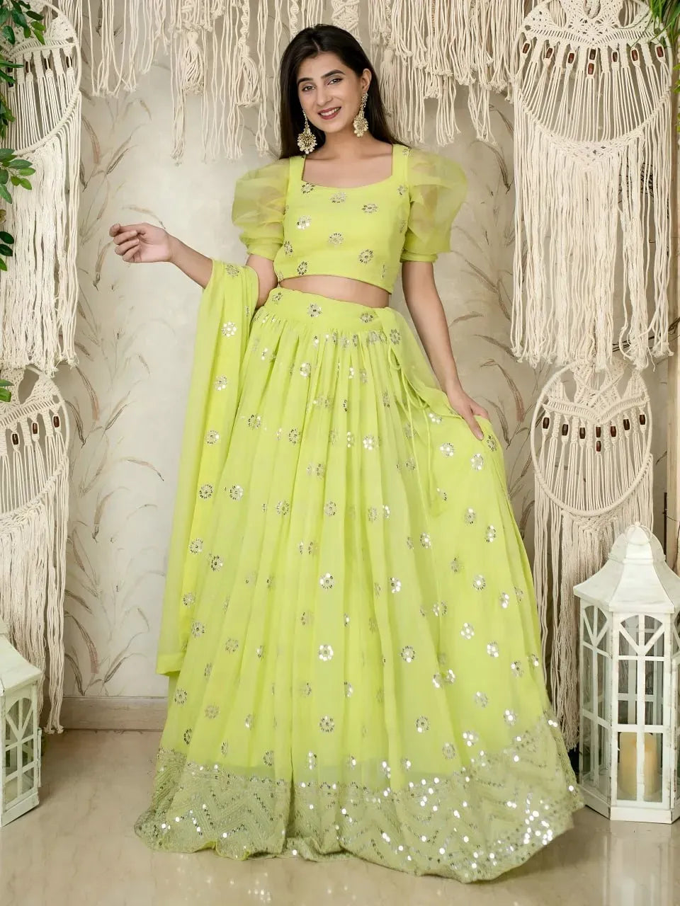 Model wearing lime green sequins embroidered lehenga with puff sleeve blouse