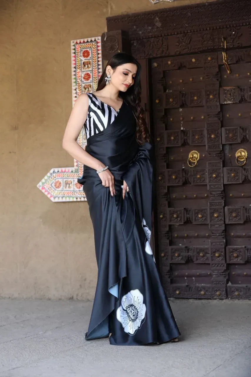 Full-length view of model standing in black satin digital print saree