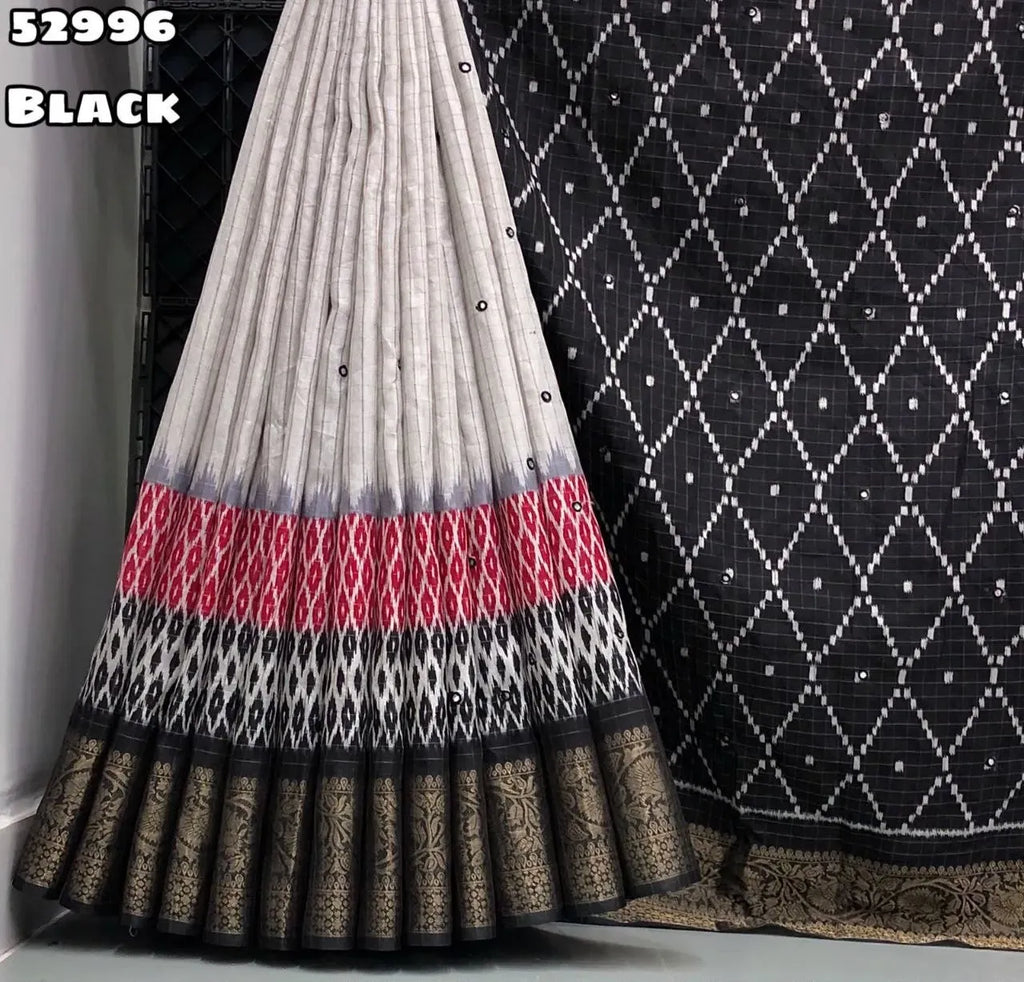 Pleated black and white georgette saree displaying rich woven border
