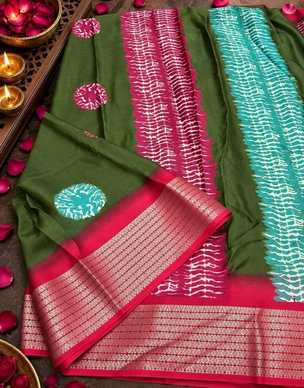 Green Dola silk saree with pink and turquoise print and gold zari border