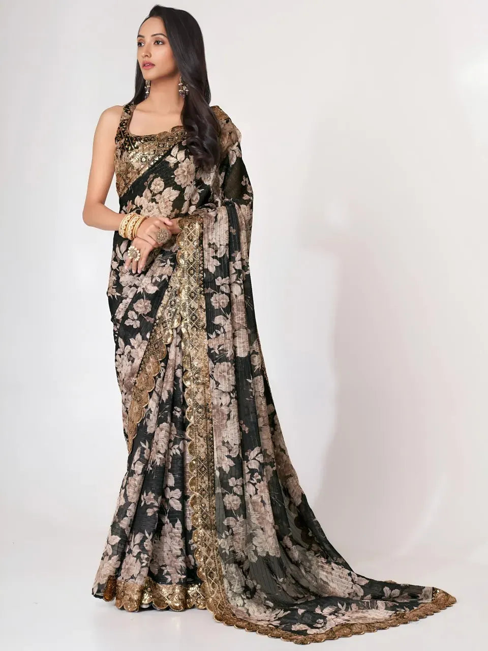 Model wearing black floral organza saree with gold border