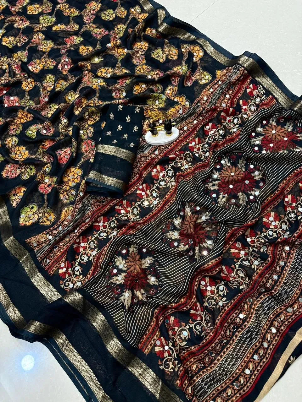 Black georgette saree with heavy mirror work and floral embroidery