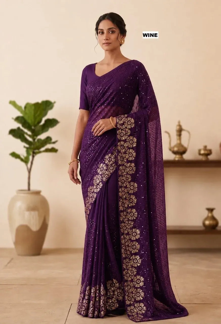 Model wearing wine purple georgette saree with heavy gold sequins embroidery