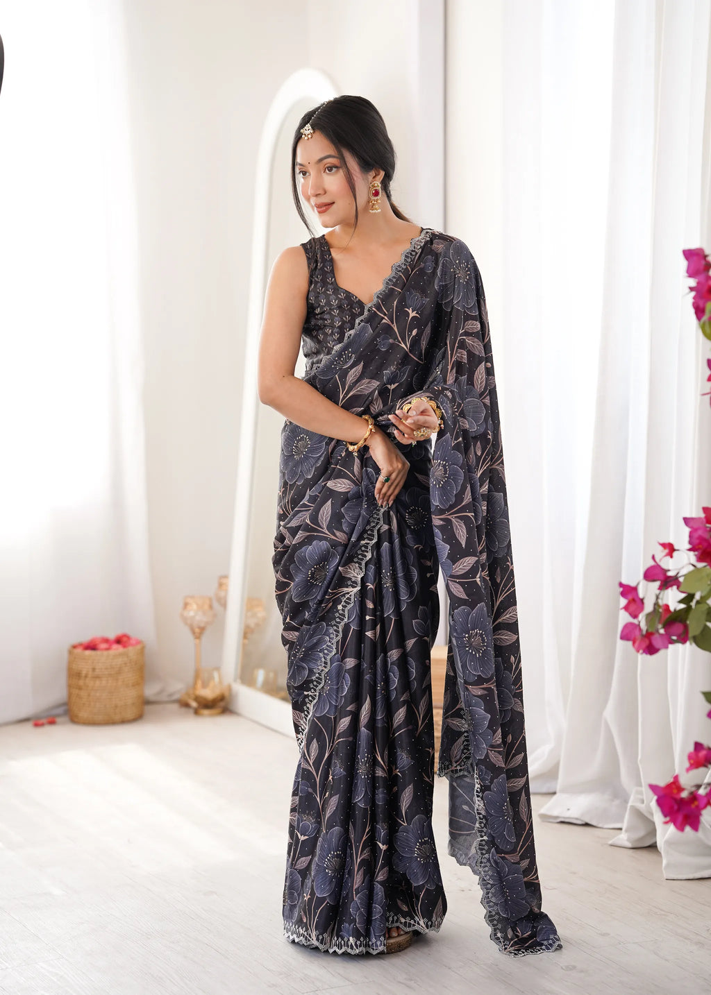 Model wearing dark floral printed chinnon saree with mirror work border