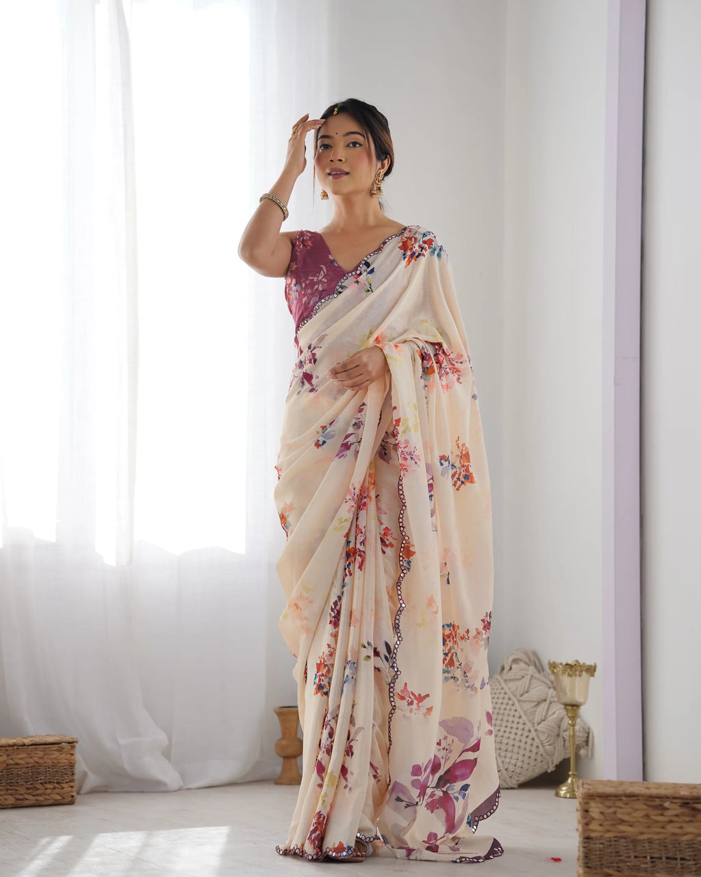 Full length view of woman posing in cream floral printed chinnon saree