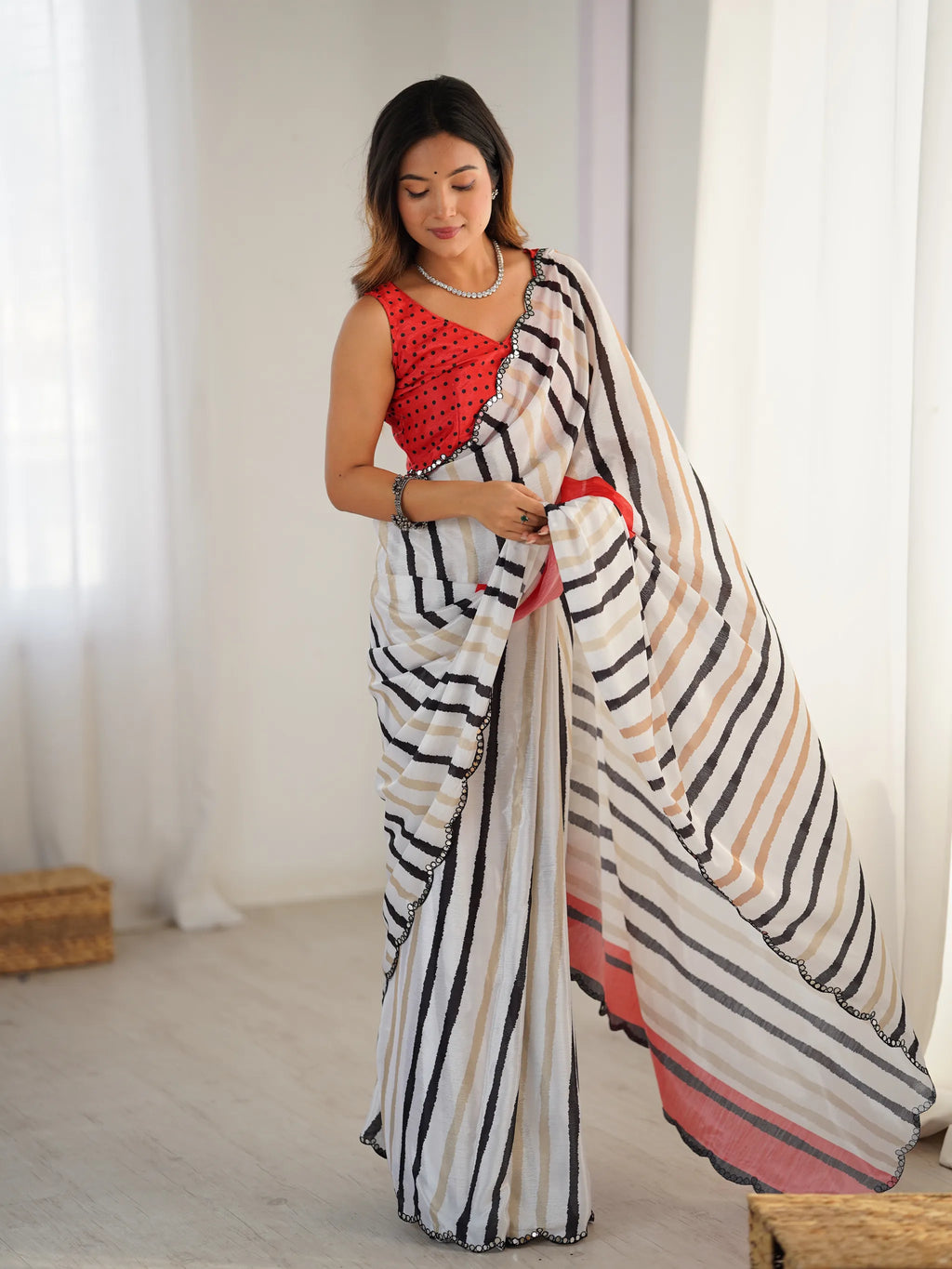 Full body shot of model wearing striped chinnon saree with unstitched blouse