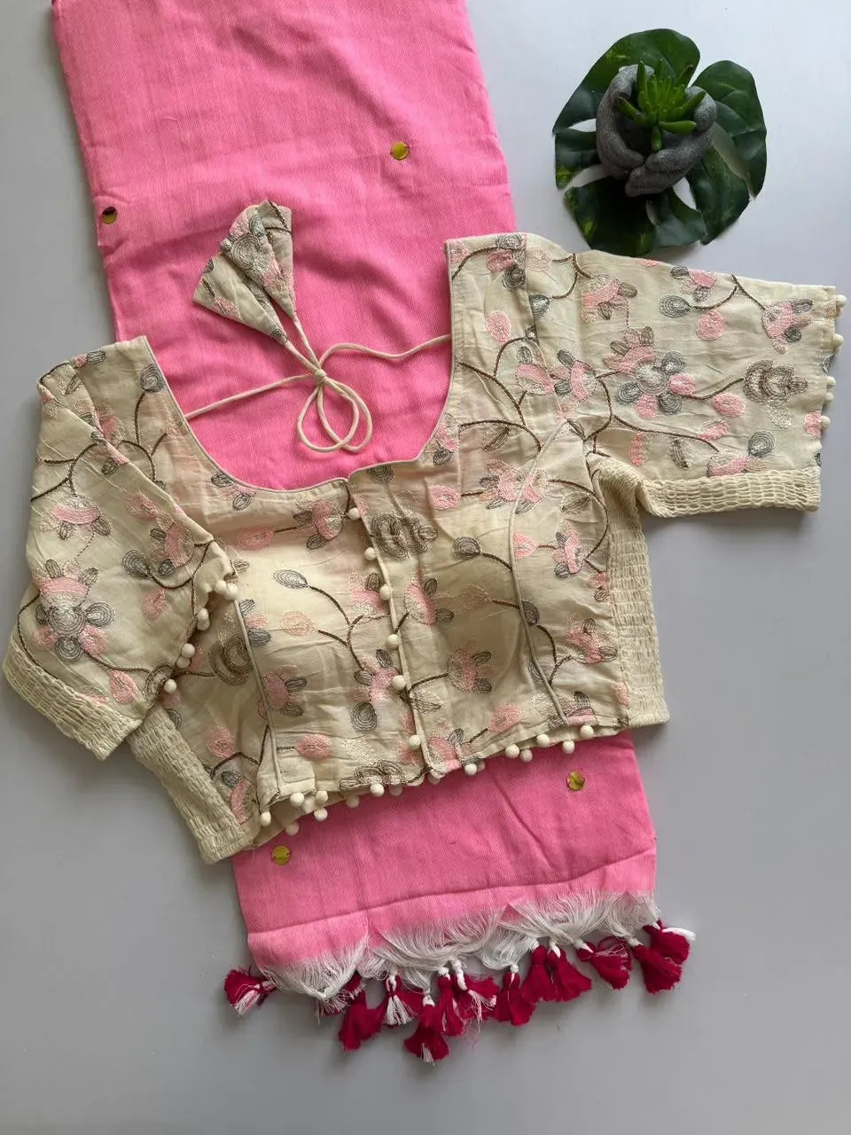 Pink khadi cotton saree folded with embroidered cream blouse