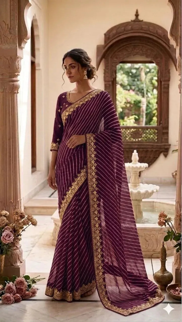 Model wearing purple lahariya saree with gold embroidery border