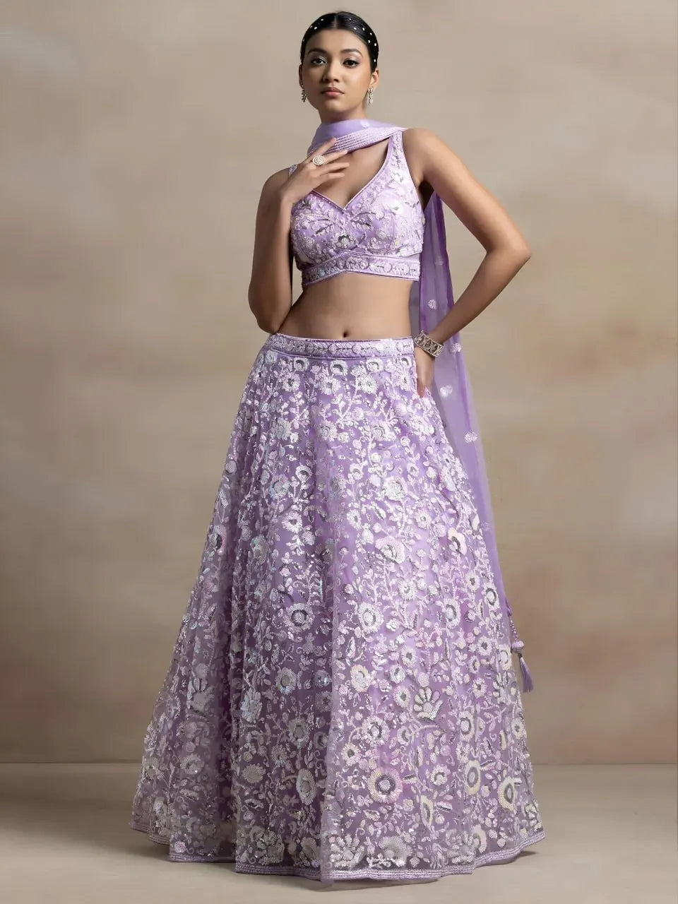 Model wearing lavender floral sequin embroidered lehenga choli front view