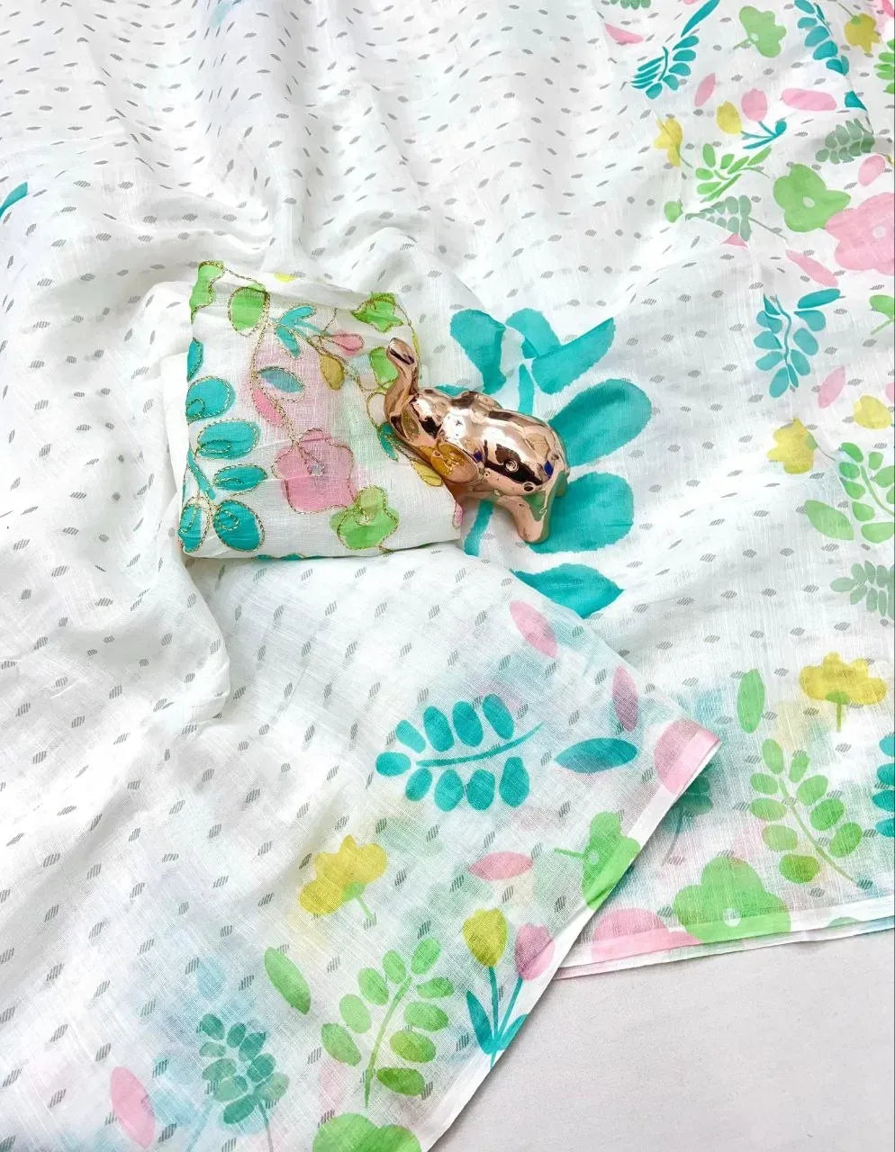 White lilan cotton saree with teal and green digital floral print and matching blouse piece