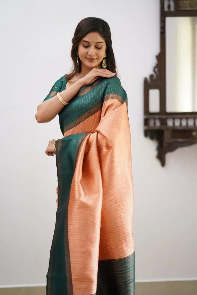 Full view of model posing in peach digital printed cotton blend saree