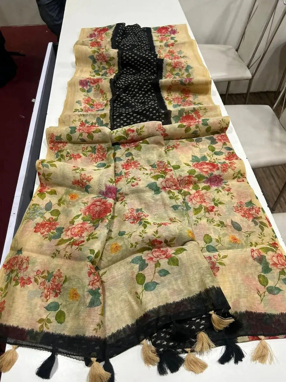 Full layout of black linen digital print saree laid out flat on white table
