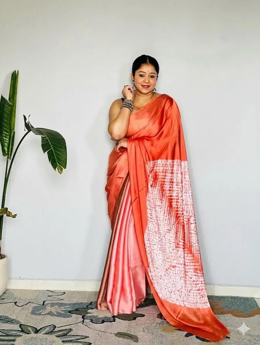 Orange model silk saree with digital print on model indoors